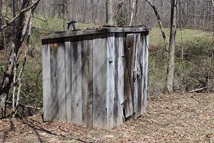 old wood outhouse