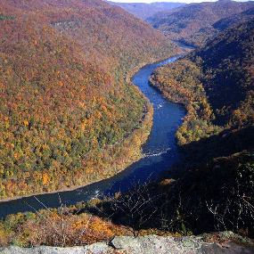 view of river and gorge with fall colors