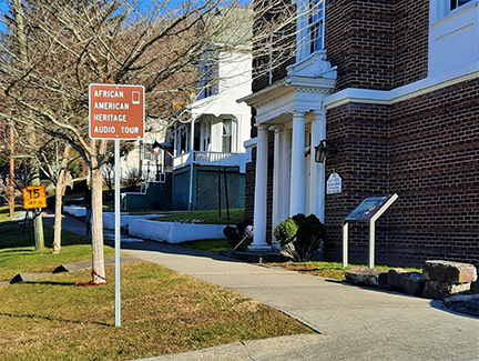 African American Heritage Driving Tour sign in front of brick church African American Heritage Driving Tour sign in front of brick church