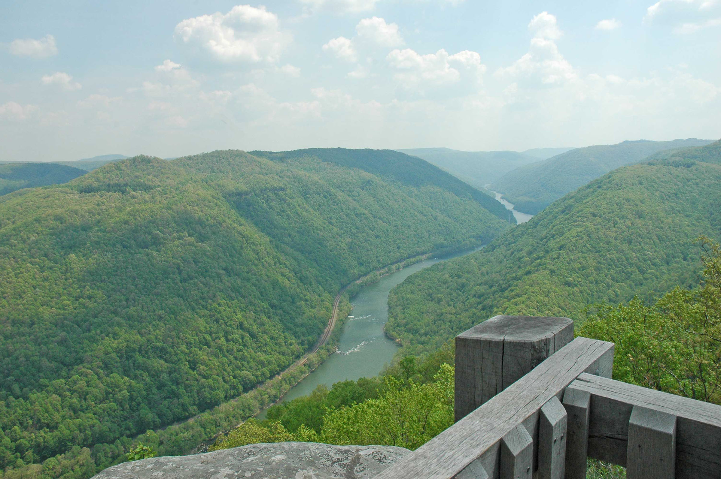 The new river flowing through the deep green slopes of the gorge at Grandview Main Overlook
