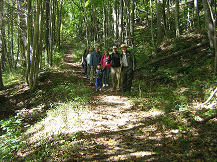 ranger on trail with visitors