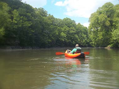 kayaker on a calm stretch of river