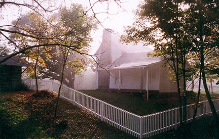 sunlight illuminates an old white farmhouse sunlight illuminates an old white farmhouse