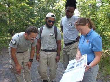 VISTA volunteer talking with NCCC team members