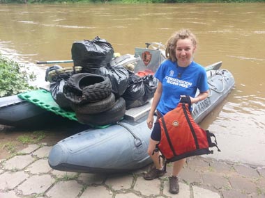 park volunteer by raft full of tires