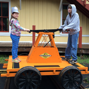 kids on a RR hand cart