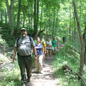 Ranger leading a hike on the Bluestone Turnpike Trail