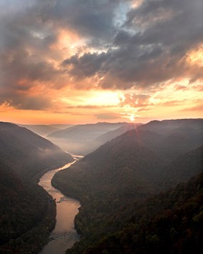 sunset over a deep river gorge