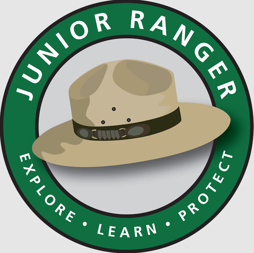 Green circular Junior Ranger logo featuring a brown ranger hat