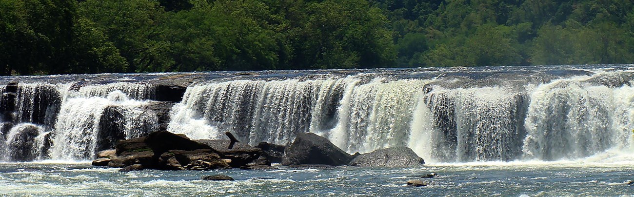 Wide waterfall over rocks