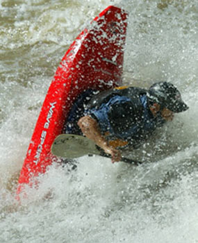 Kayak surfing in whitewater Kayak surfing in whitewater