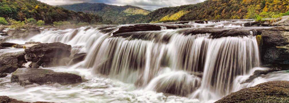 cascading waterfall on river in a deep gorge