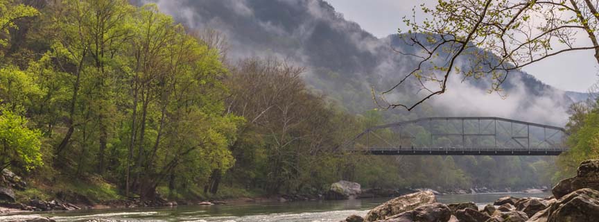 bridge spanning river with clouds bridge spanning river with clouds
