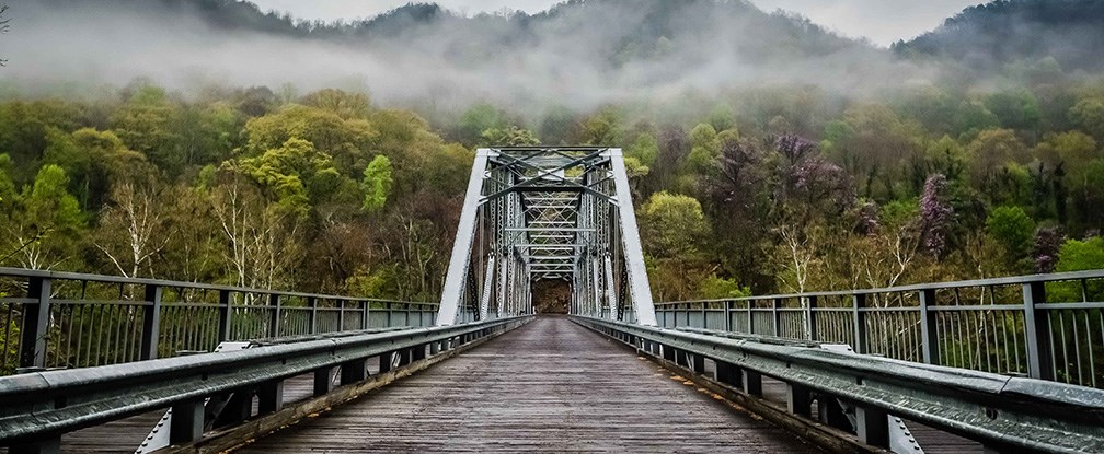 bridge over river with fog