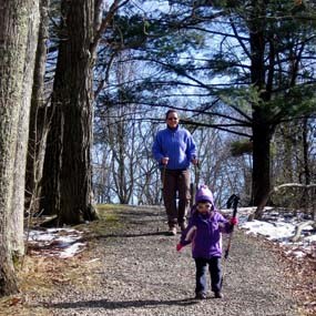 Mother and young daughter hiking