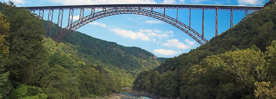 bridge spanning river and gorge