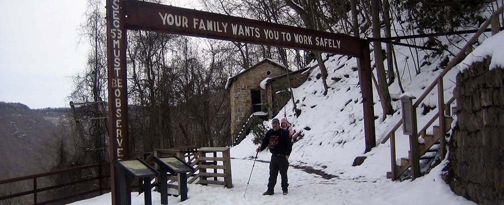 Hiker under safety sign Hiker under safety sign