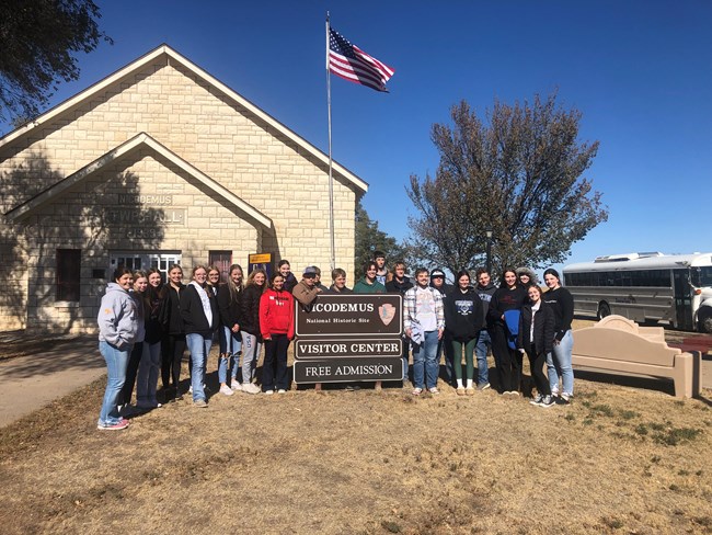 A group of school kids in front of township hall