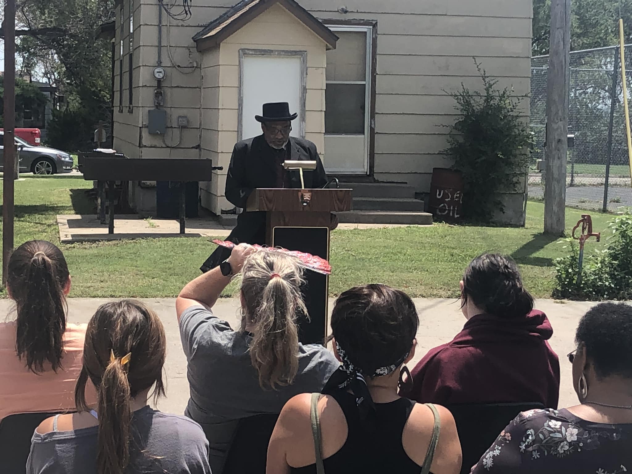 Come join us for presentations and performances A man gives a speech at a podium