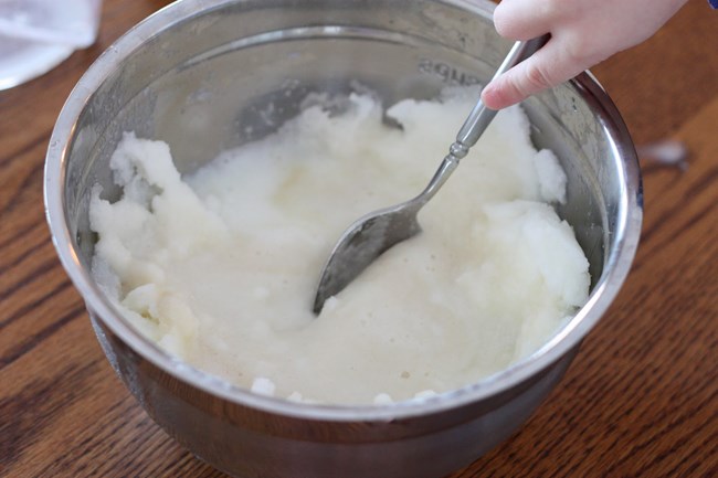 a metal bowl of snow ice cream