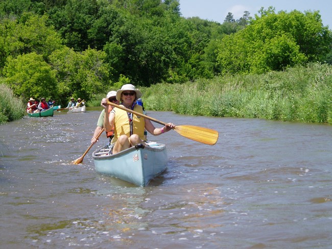 Smiling canoers, paddling along the Niobrara NSR