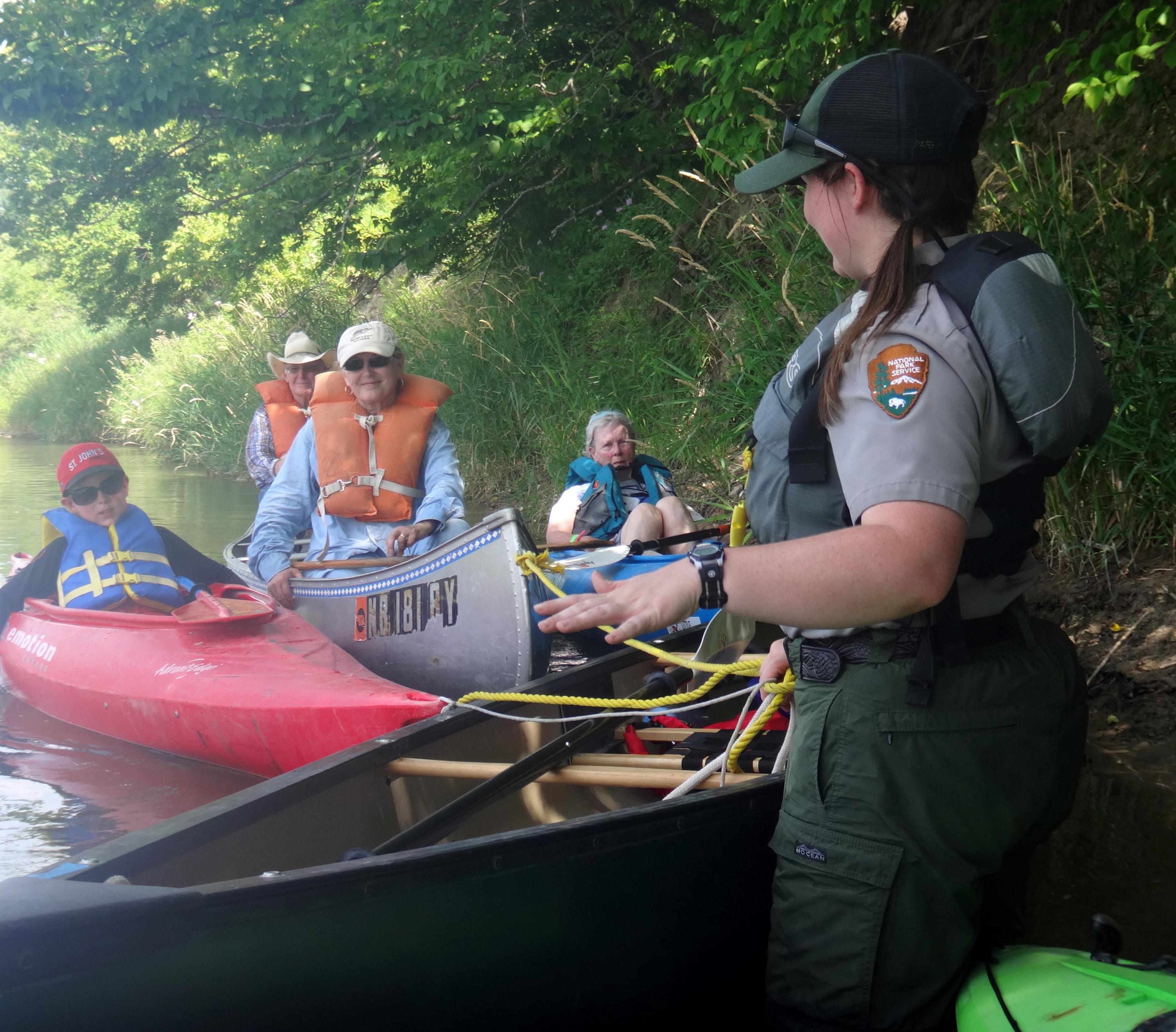 A park ranger points out special features about the Niobrara NSR to a group of paddlers.