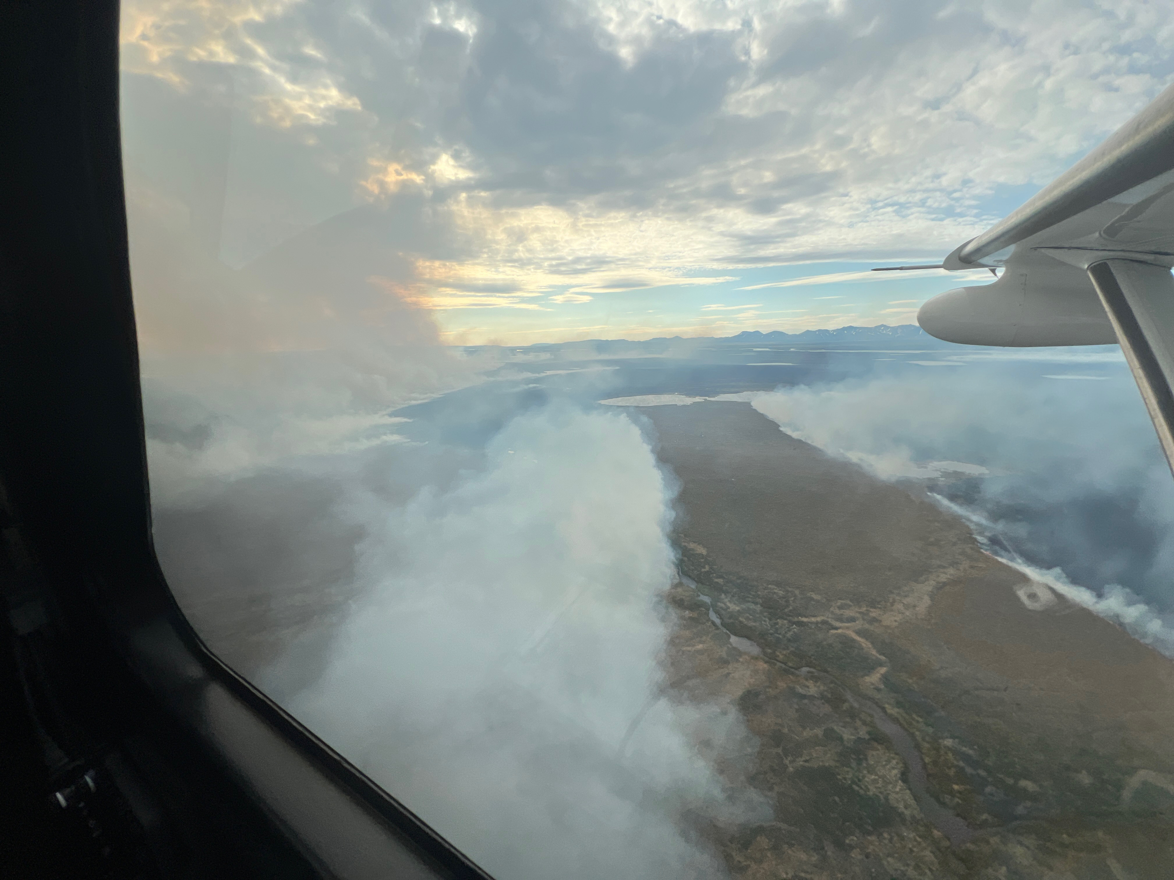 135-Tututalak - June 16, 2024 Smoke trails into the air from the Tututalak fire in the tundra.
