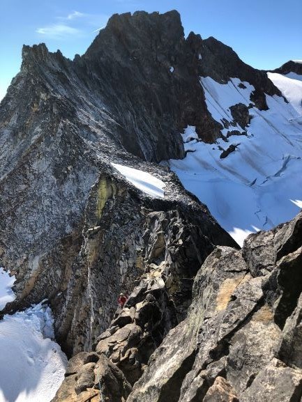 Sharkfin Tower with climber late August