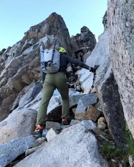 Climber ascend rocky gully