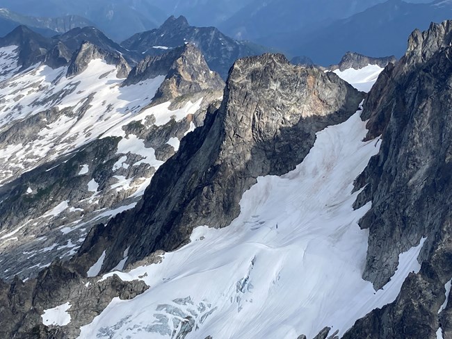 Early Morning spire and the descent col to the right