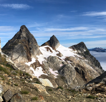 View of Paul Bunyan's Stump, Pinnacle Peak and Pyramid Peak tower over the Colonial Glacier from the Colonial/Neve Col