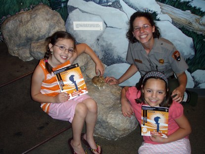 A Ranger with two new Junior Rangers