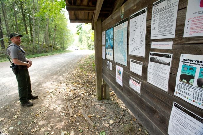 Ranger Mike at the Hozomeen Notice Board Image: NPS/David Snyder