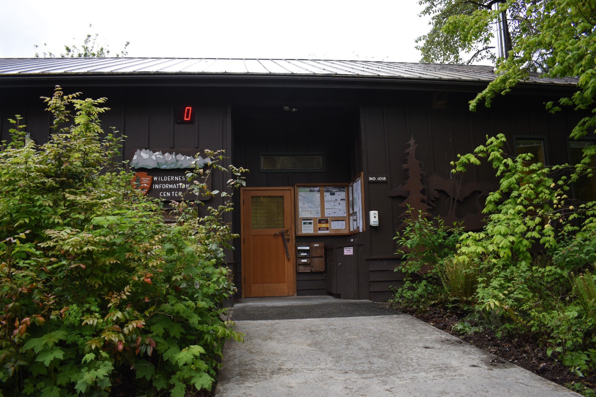 brown building with sign that reads "Wilderness Information Center