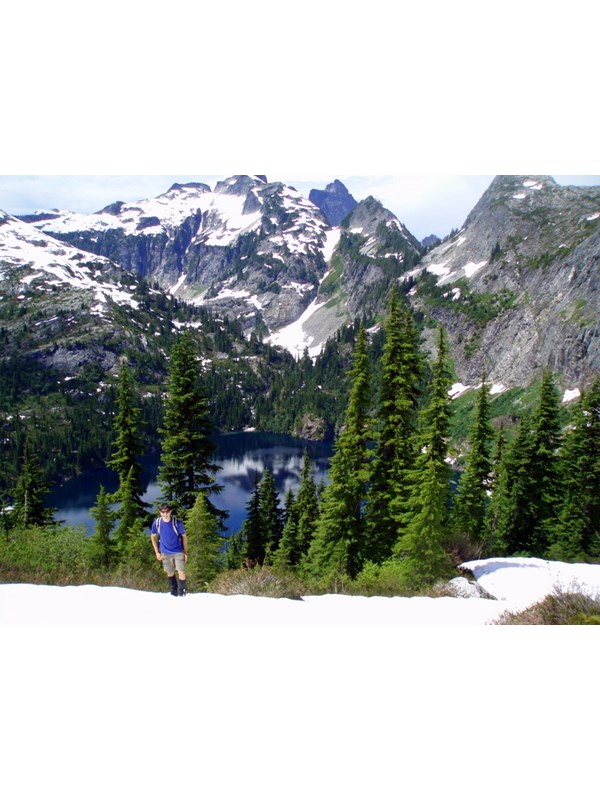 Hiker on ridge above Thornton Lake