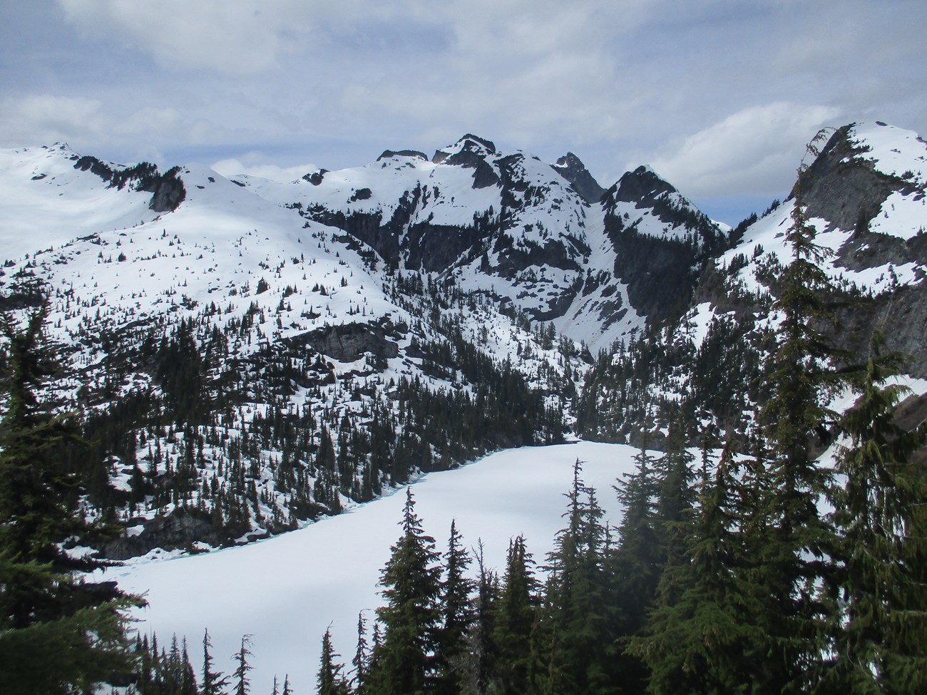 Snow covered lake and mountains