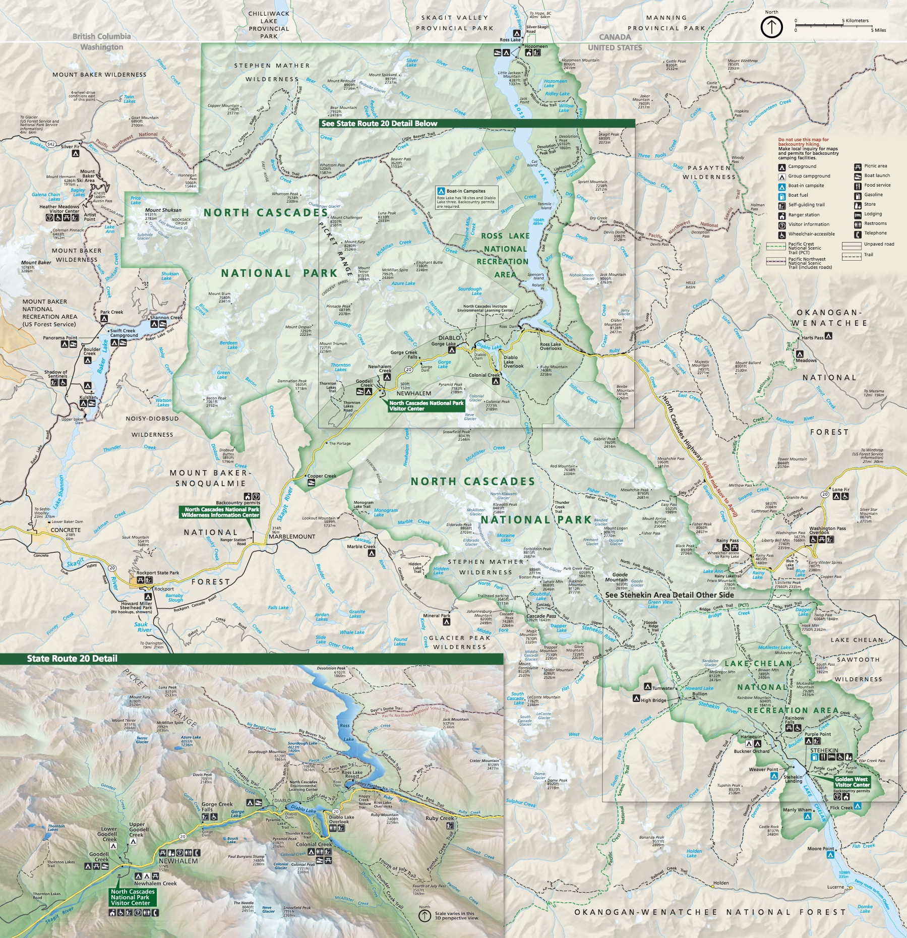 Map of North Cascades National Park in Washington. Park areas are shaded light green, national recreation areas are darker green, and outlying areas are tan. Scores of sites, peaks, and bodies of water are labeled across the map.