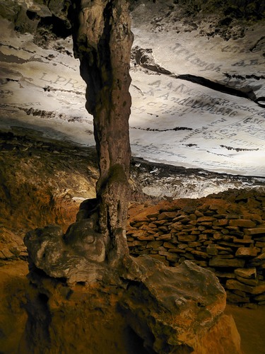 A large stone pillar connecting the floor to ceiling. 