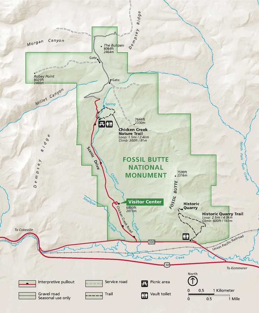 Map of Fossil Butte National Monument in Wyoming. Park areas are outlined in green, and surrounding terrain is shaded tan. Roads are represented with red lines, and the Union Pacific Railroad is shown as a gray line.