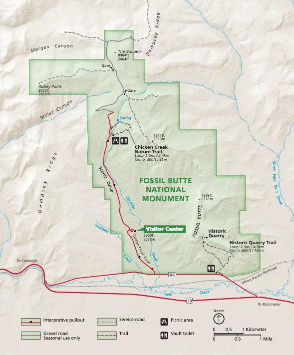 Map of Fossil Butte National Monument in Wyoming. Park areas are outlined in green, and surrounding terrain is shaded tan. Roads are represented with red lines, and the Union Pacific Railroad is shown as a gray line.