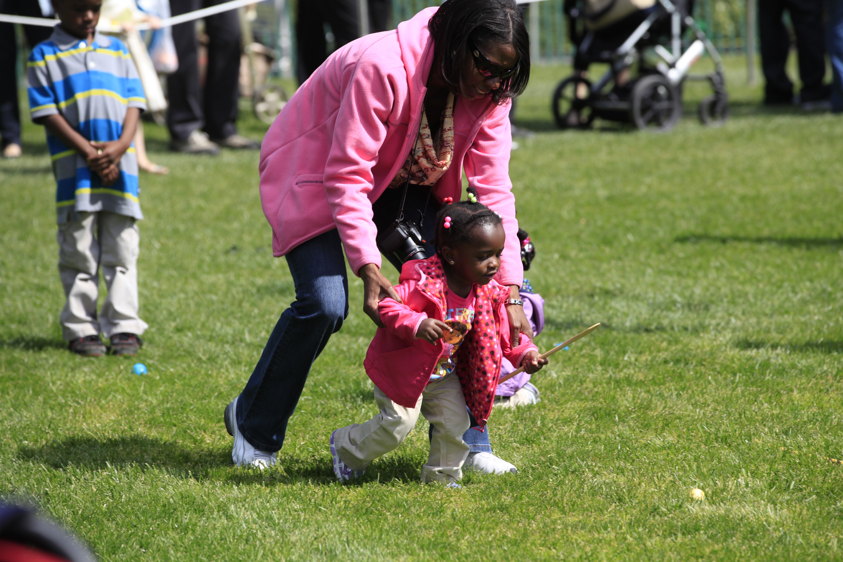 A young girl and her mom participate in the Egg Roll.