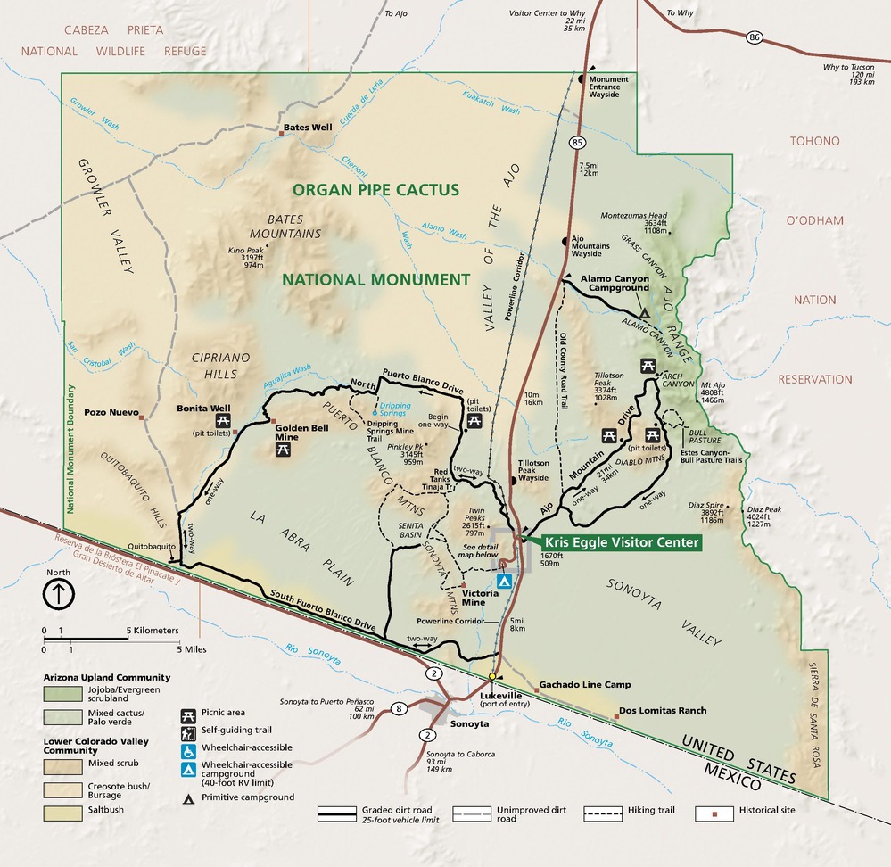 Map of Organ Pipe Cactus National Monument in Arizona. This trapezoidal park shows the topography in shades of green and brown. The areas outside the park boundary are pale tan.