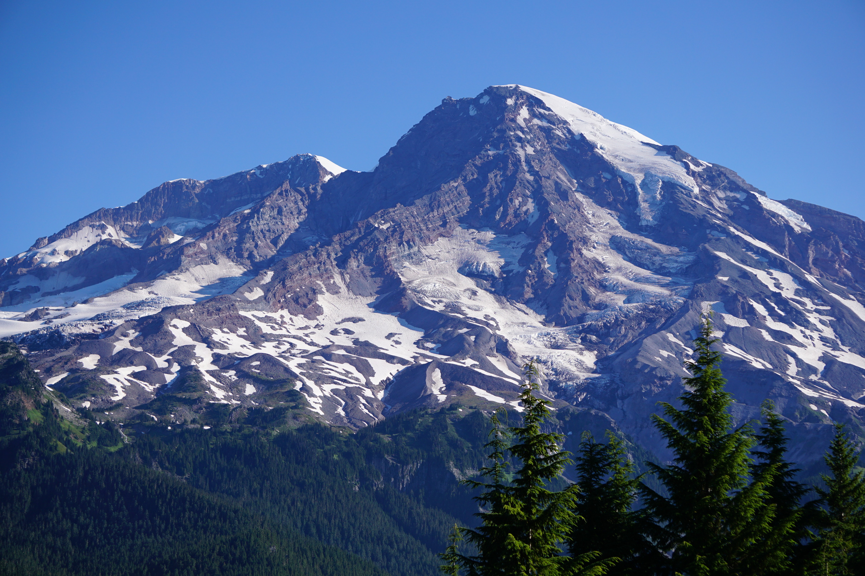 amazing hikes in the western US A rocky and glacier covered mountain peak. 