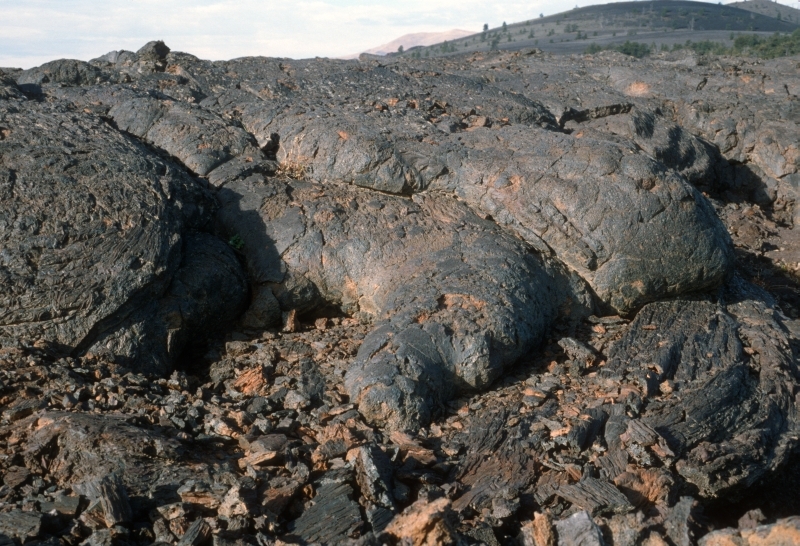 the end of a black lava flow with a billowy cloud-like shape 