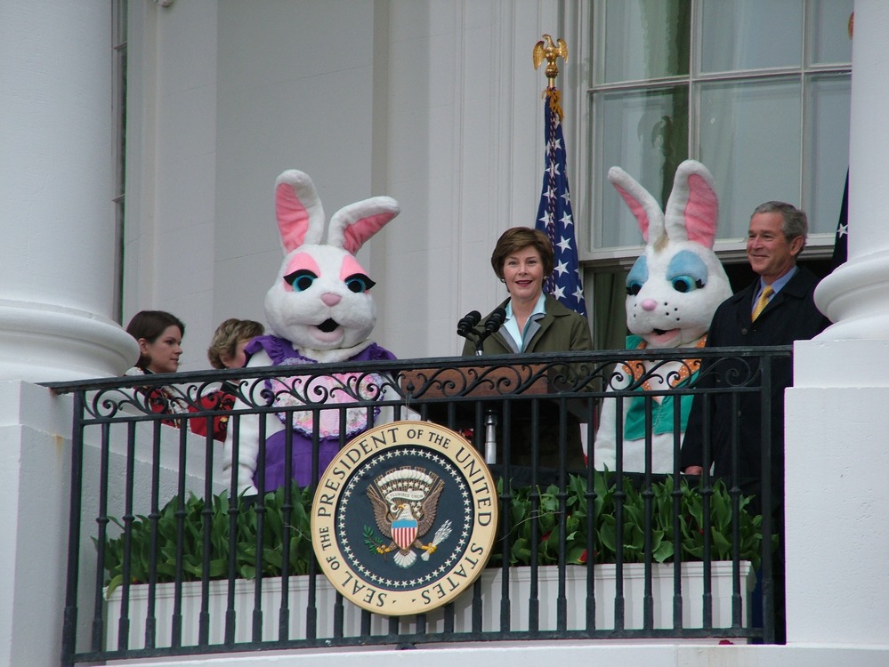 First Lady Laura Bush and President George Bush, with two Easter bunny strolling characters. 