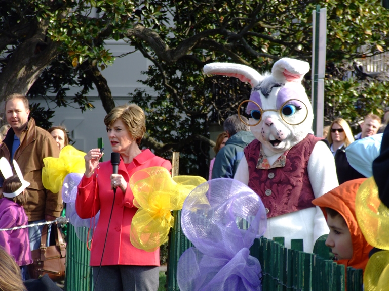 First Lady Laura Bush whistles to begin the egg roll