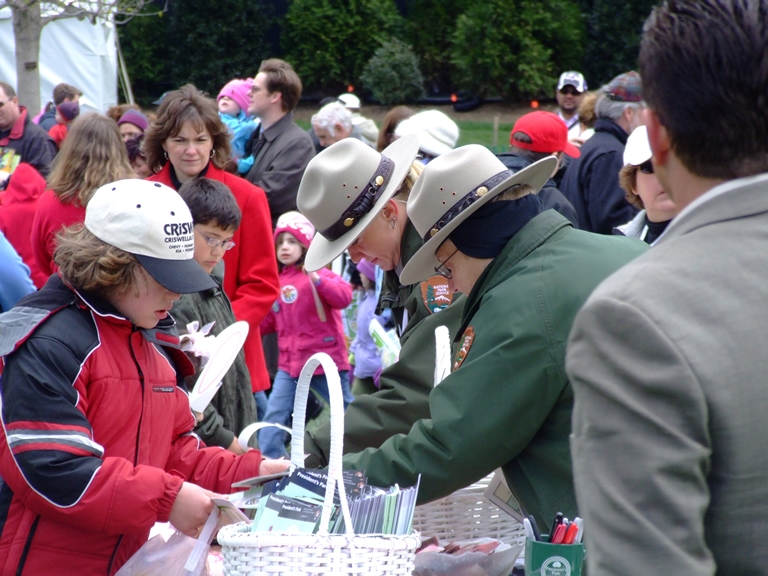 National Park Service rangers talk to children about becoming a Junior Ranger