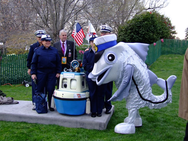Strolling character "Officer Snook" posed with his U.S. Coast Guard crew on the White House South Lawn.