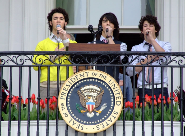 The Jonas Brothers sing "The Star Spangled Banner" on the Truman balcony of the White House.