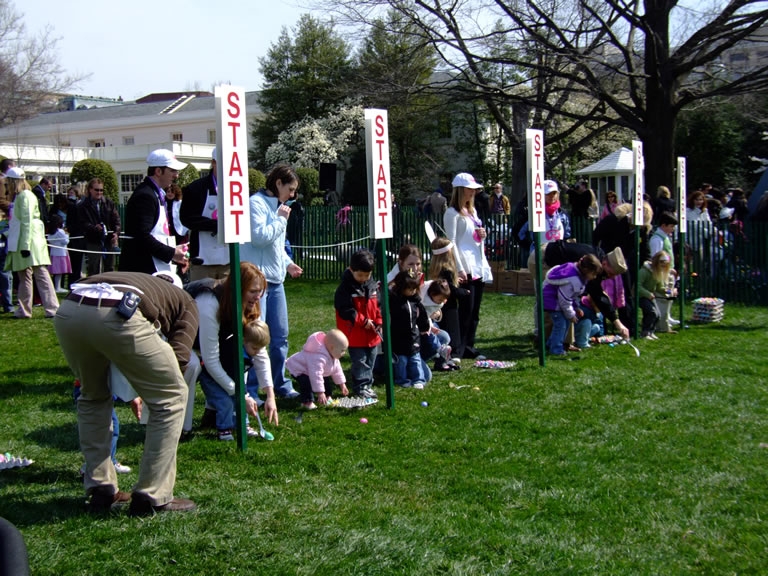 Children prepare for the egg roll. 